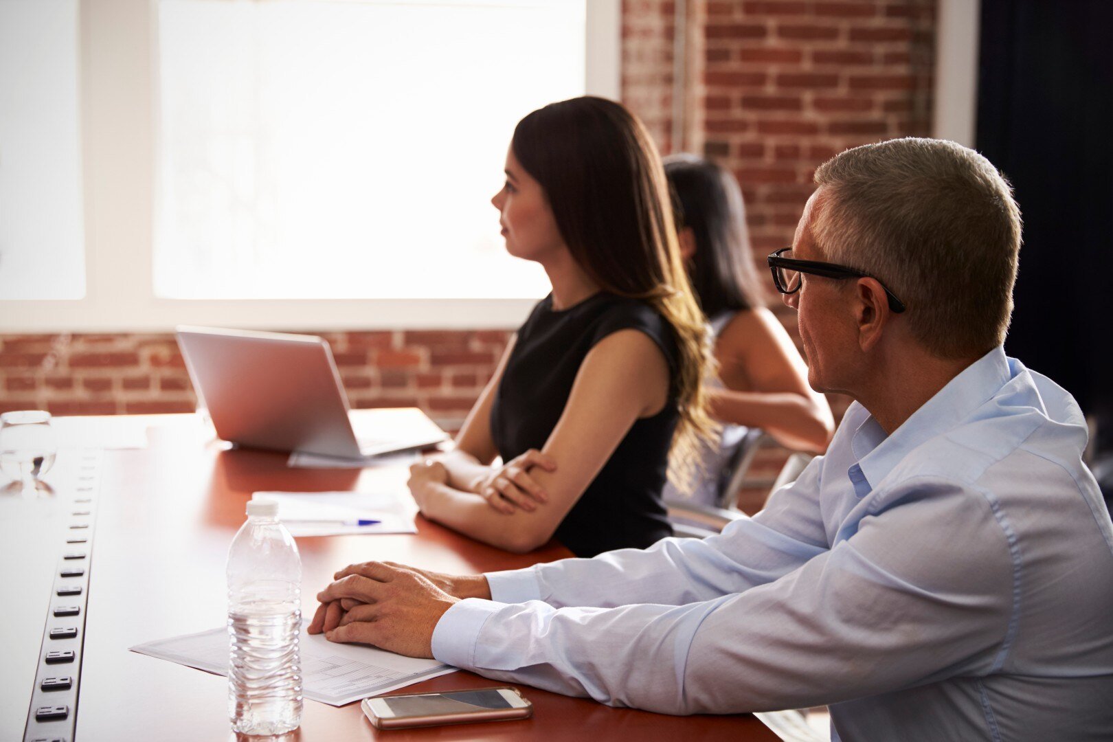 businesspeople-listening-to-presentation-in-boardr-2024-10-19-12-40-22-utc (Custom)