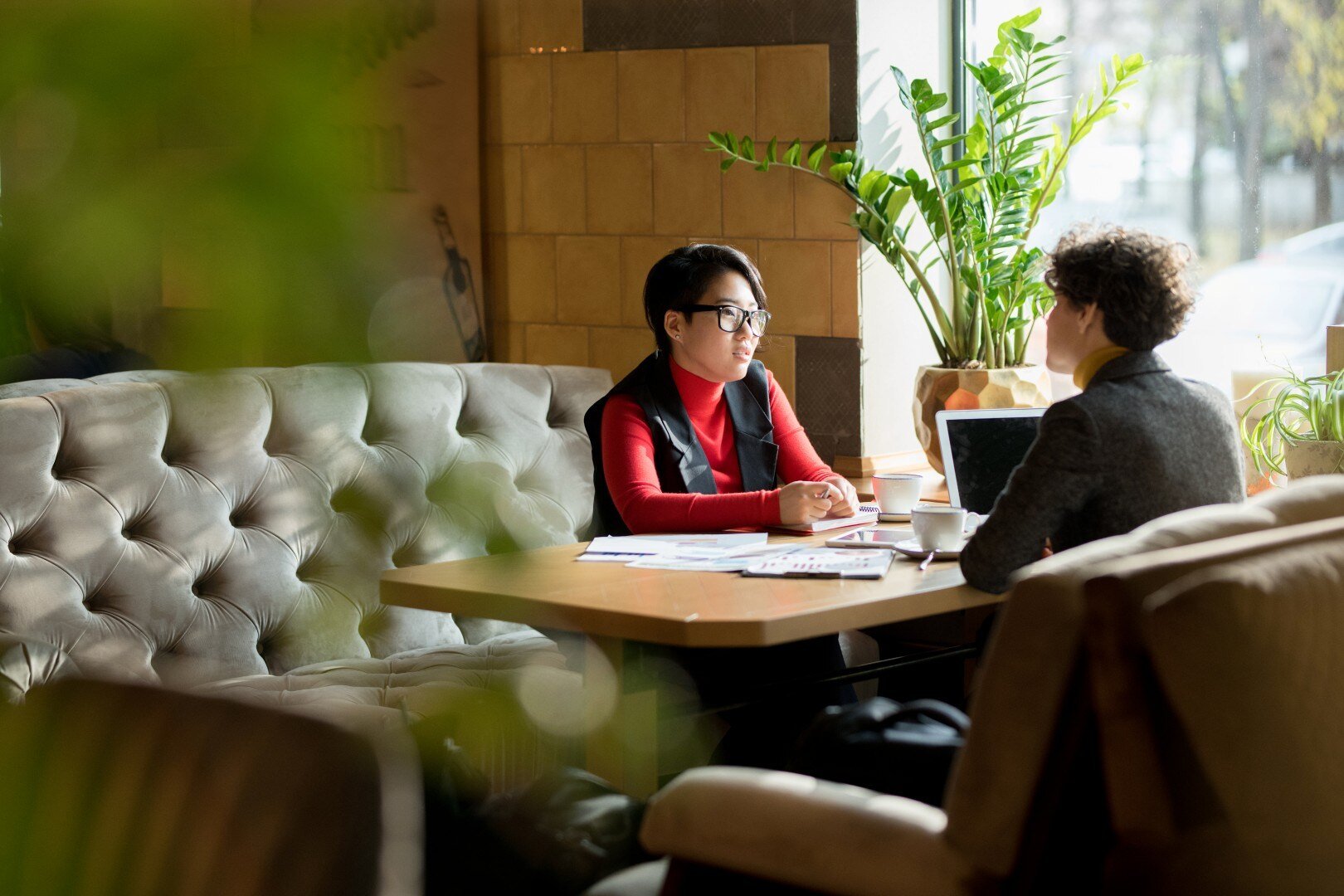 busy-ladies-talking-in-modern-cafe-2025-03-09-15-59-48-utc (Custom)-1
