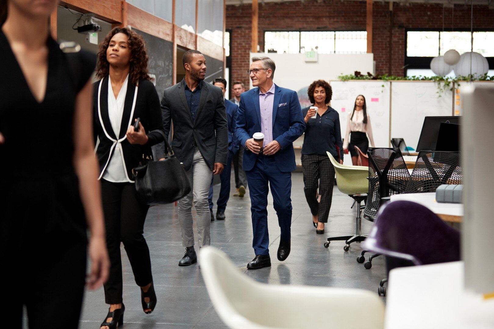 businesspeople-arriving-for-work-in-busy-modern-op-2024-10-19-02-16-15-utc (Custom)-1