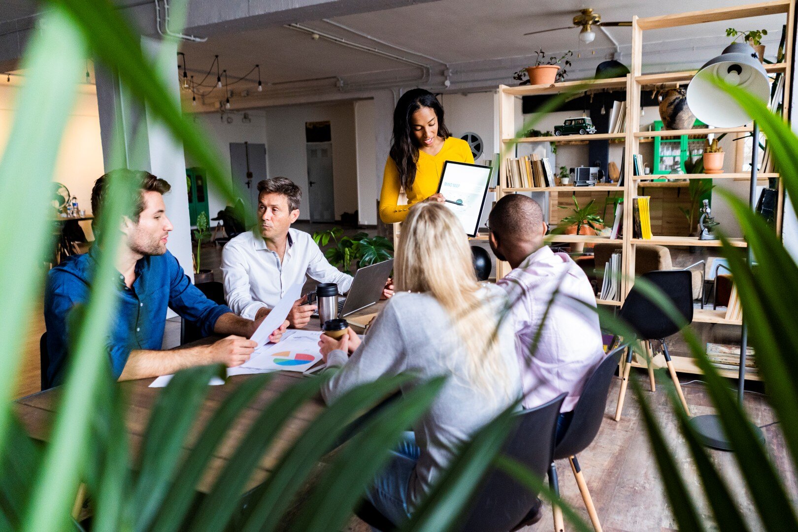businesswoman-leading-a-presentation-in-loft-offic-2024-09-15-22-44-27-utc (Custom)